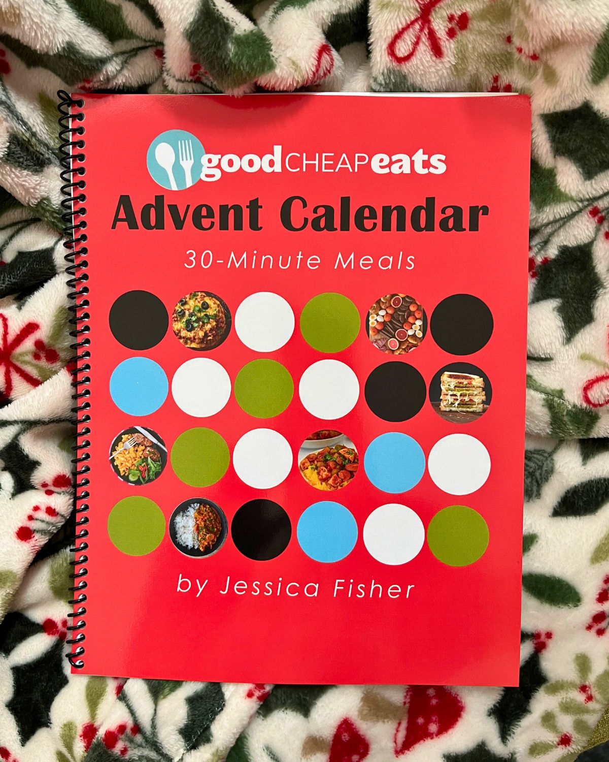 printed meal plan advent calendar on a christmas blanket.