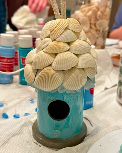 birdhouse with a seashell roof.