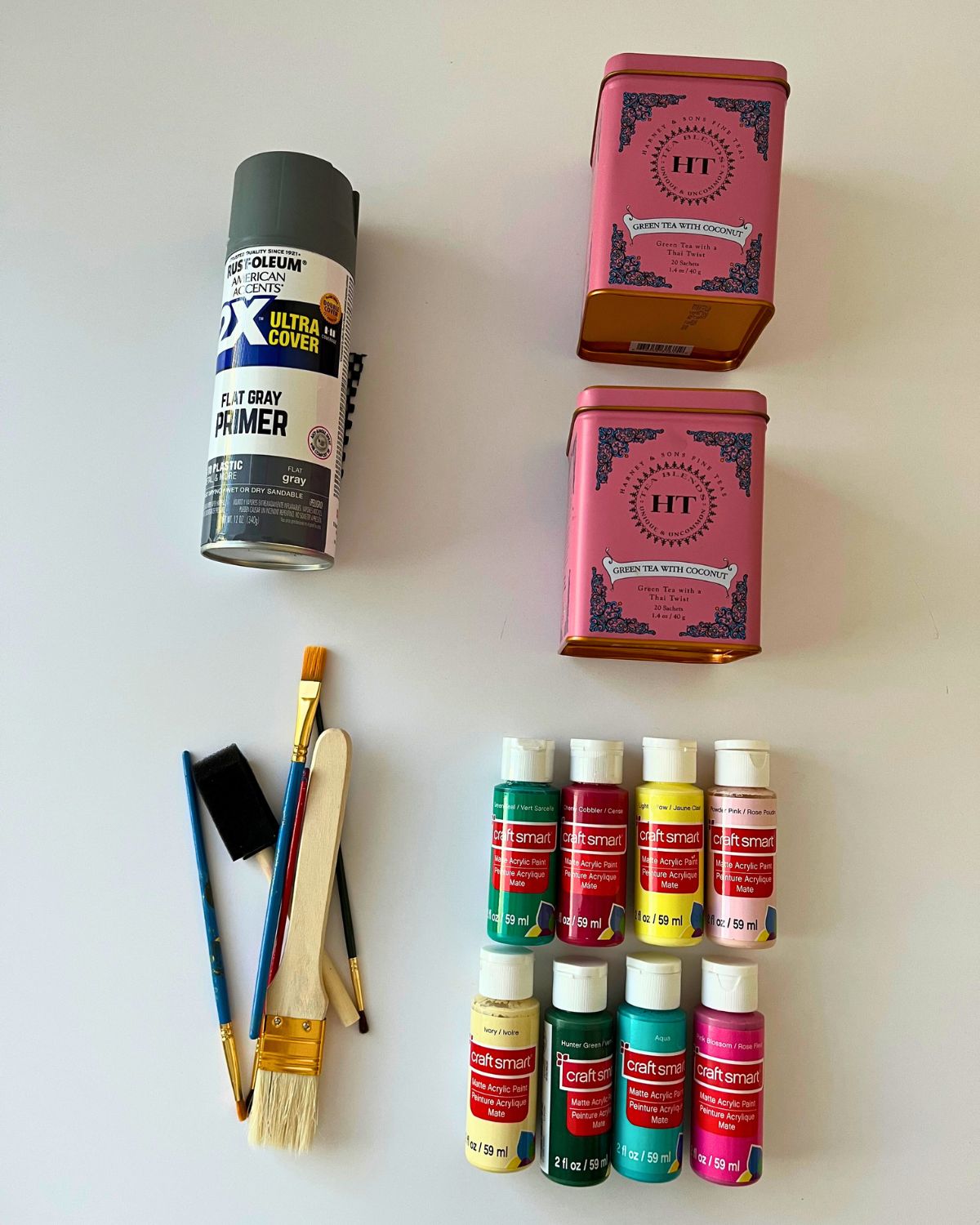 tea tins plus supplies for painting them.