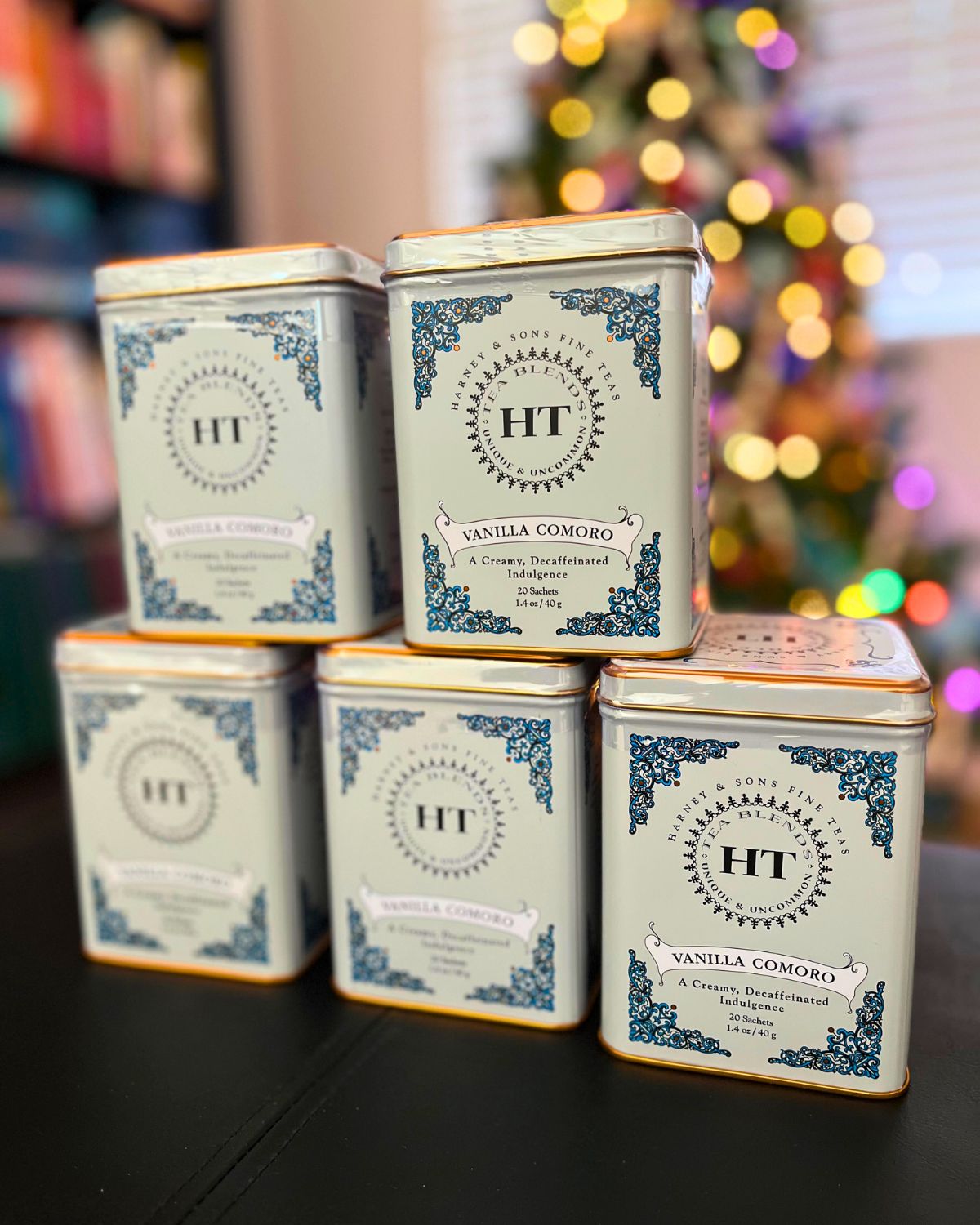 stacks of harness tea in front of christmas tree.