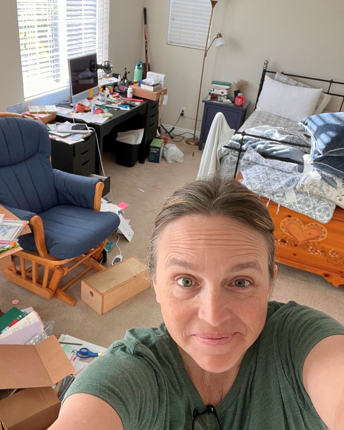 selfie of jessica with mess in the background.