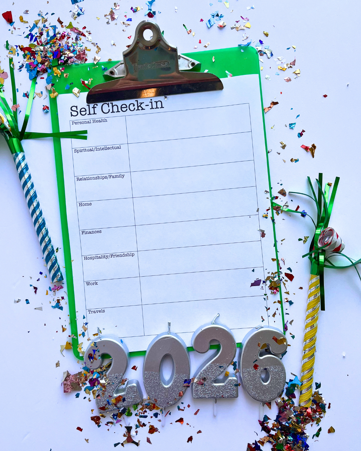 self check in worksheet on clipboard with 2026 candles and confetti.