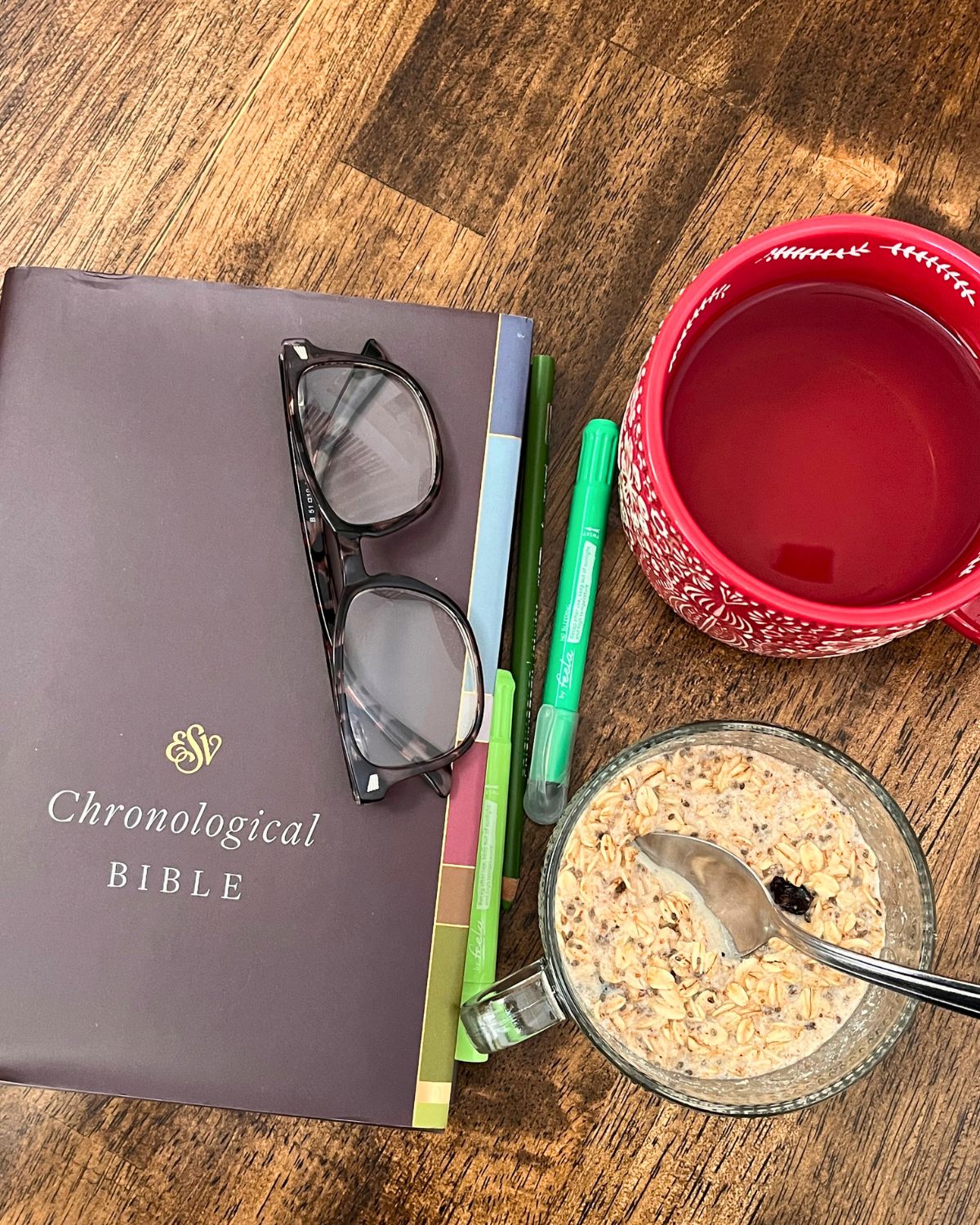 bible, glasses, highlighters, tea, and oatmeal.