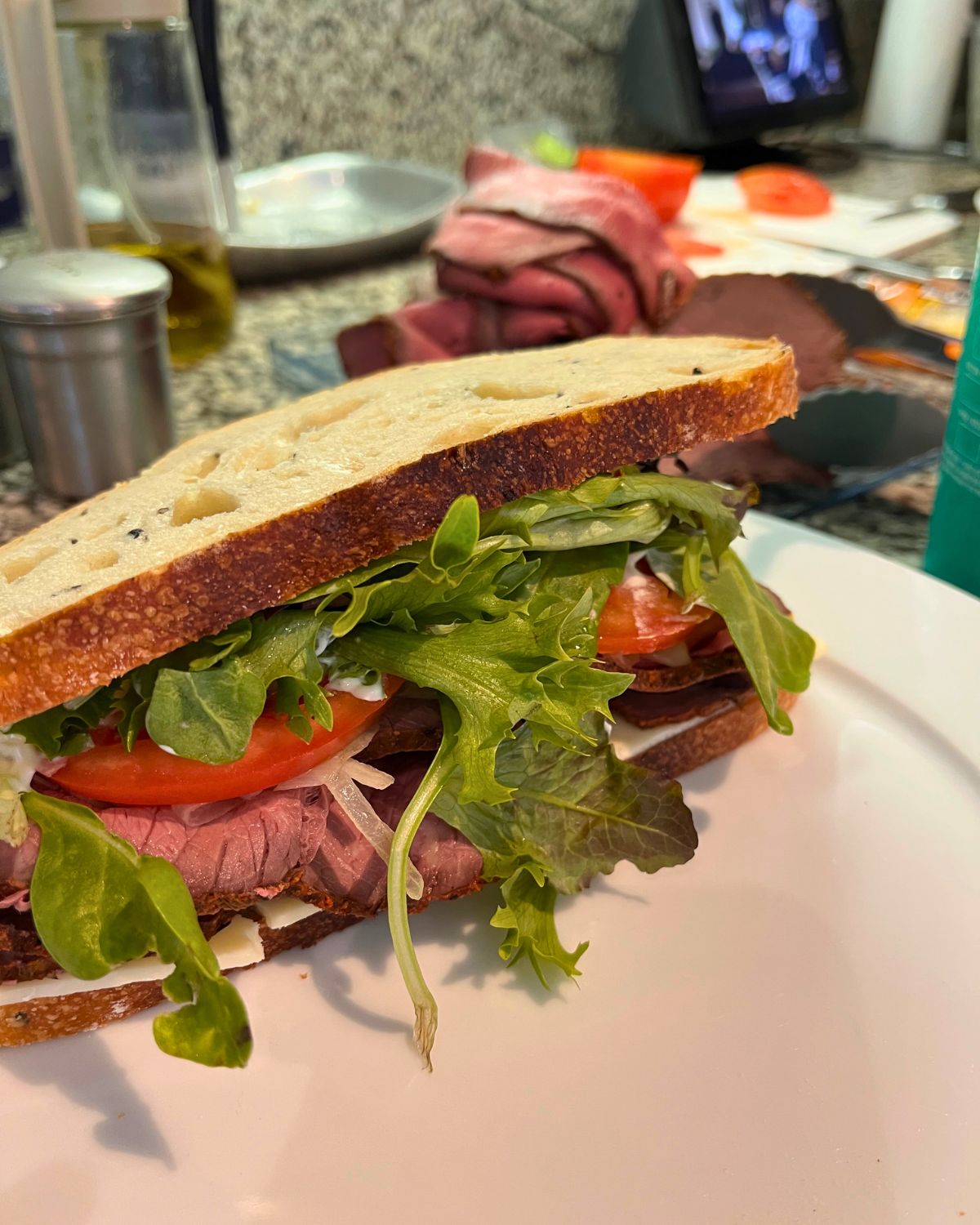 homemade roast beef on homemade bread on counter.