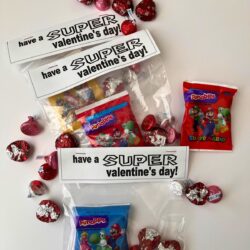 super mario treat bags on table with extra candy.