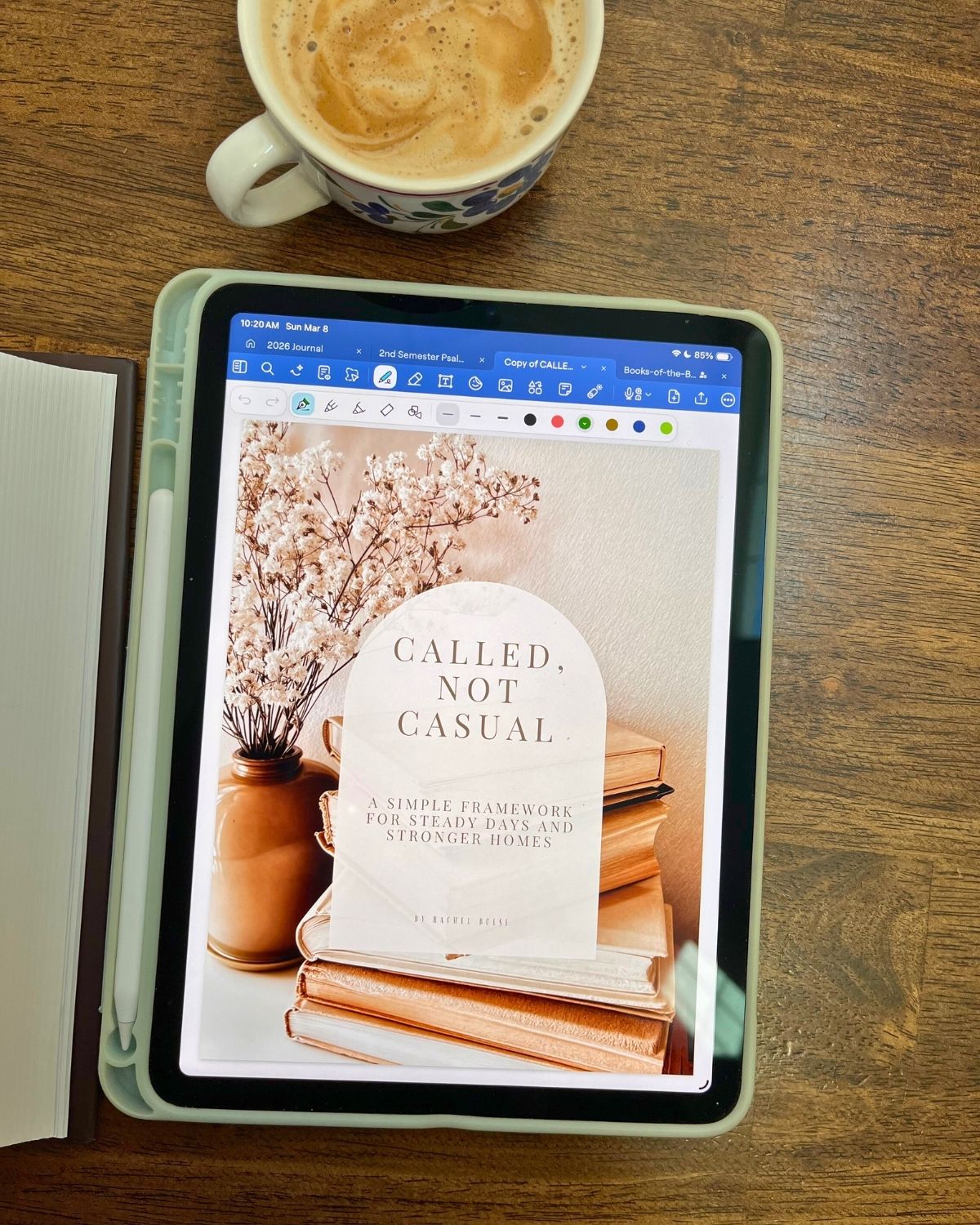 coffee and iPad with the cover of called not casual showing on the screen.