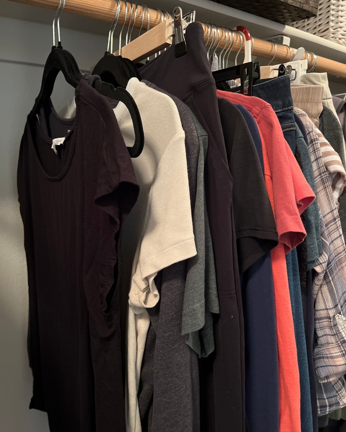 clothes hanging in closet.