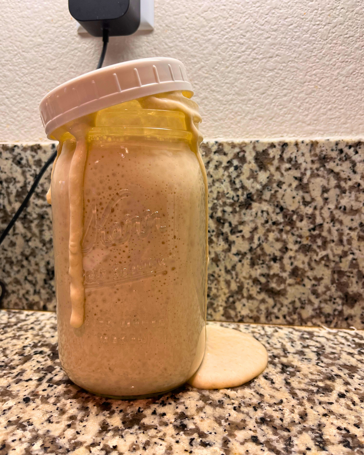 overflowing jar of starter.