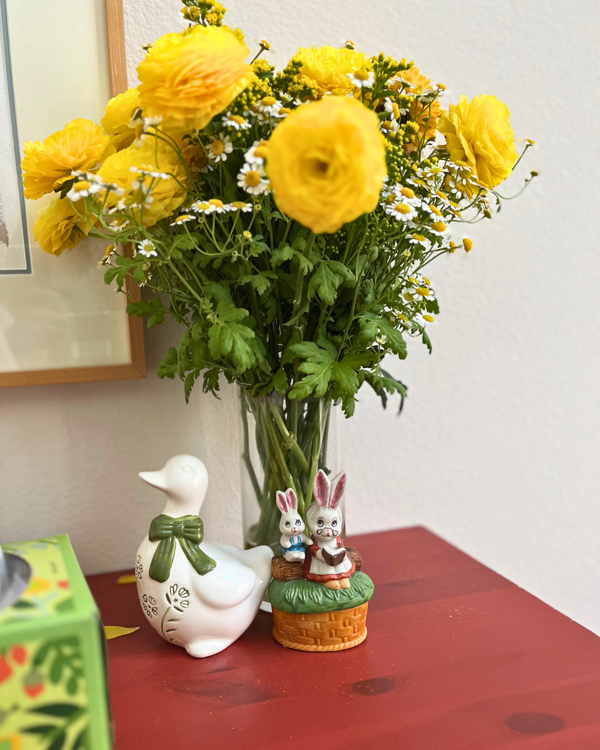 spring decor on red dresser.