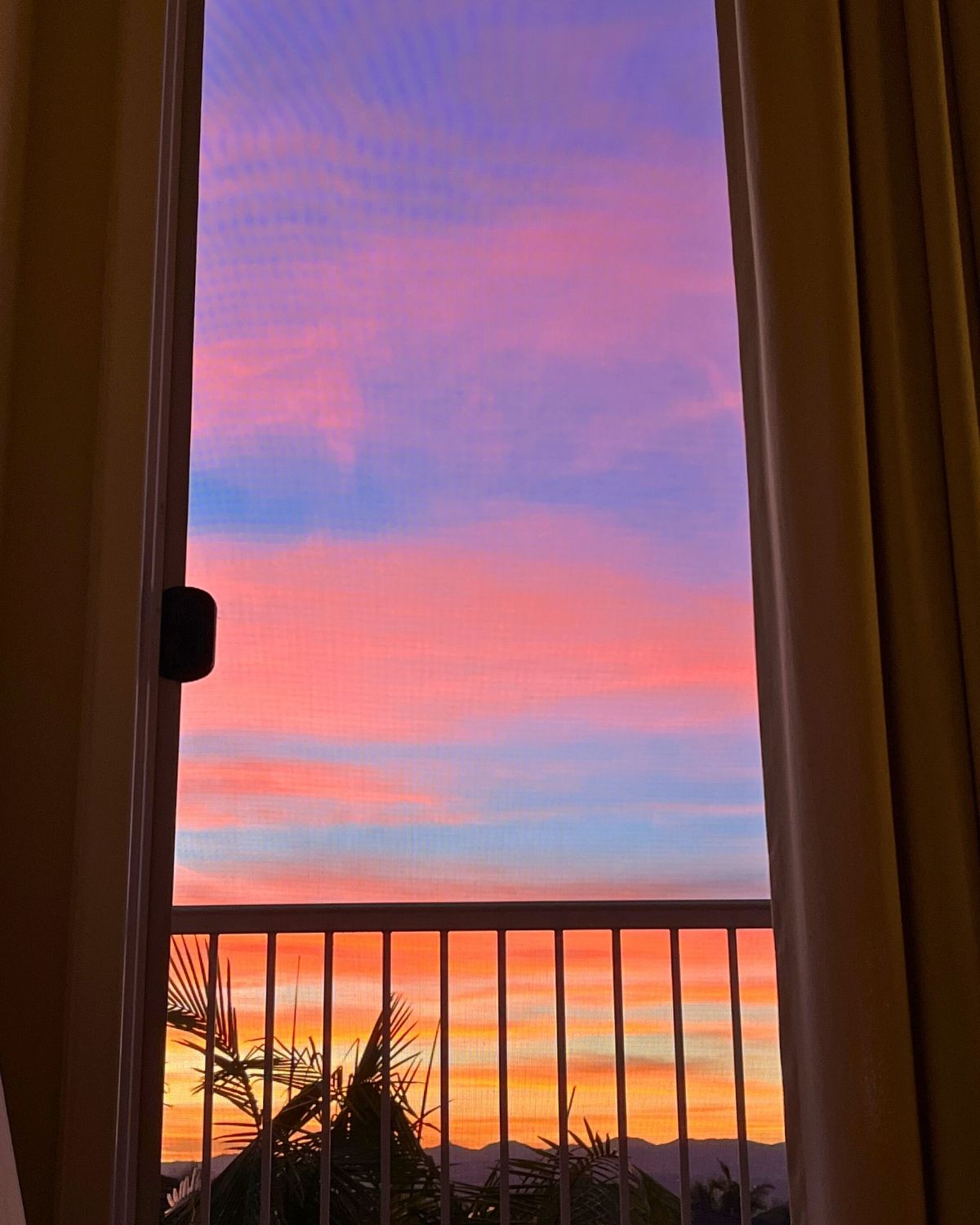 sunrise through the balcony door.