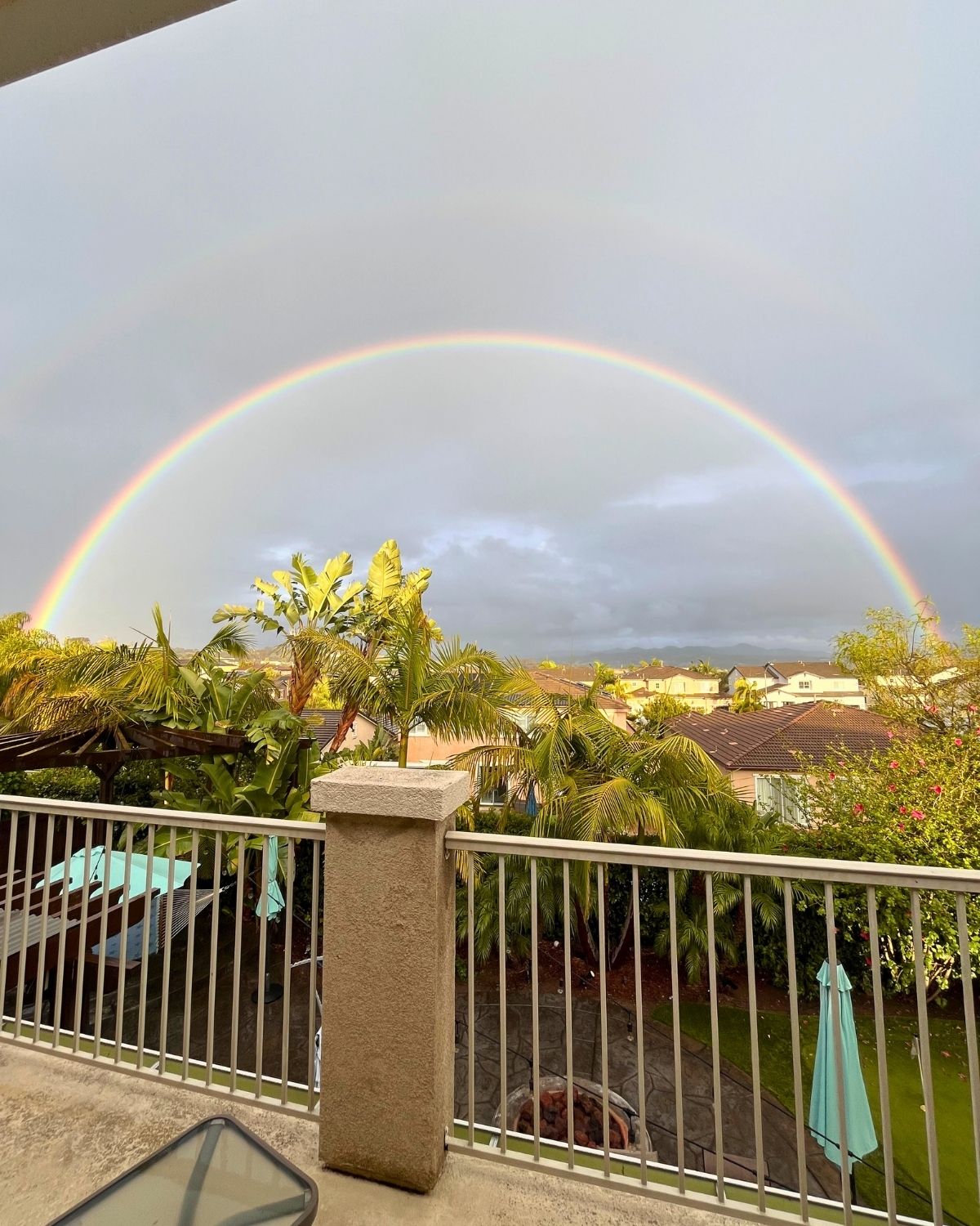 double rainbow out the balcony view.