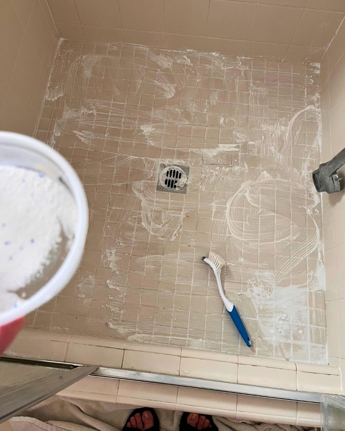 shower floor covered in oxiclean paste.