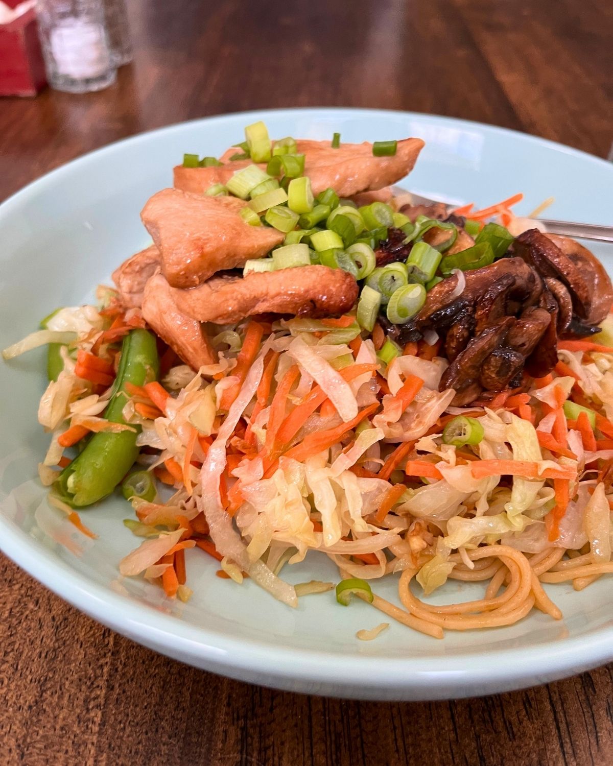homemade yakisoba on blue plate.