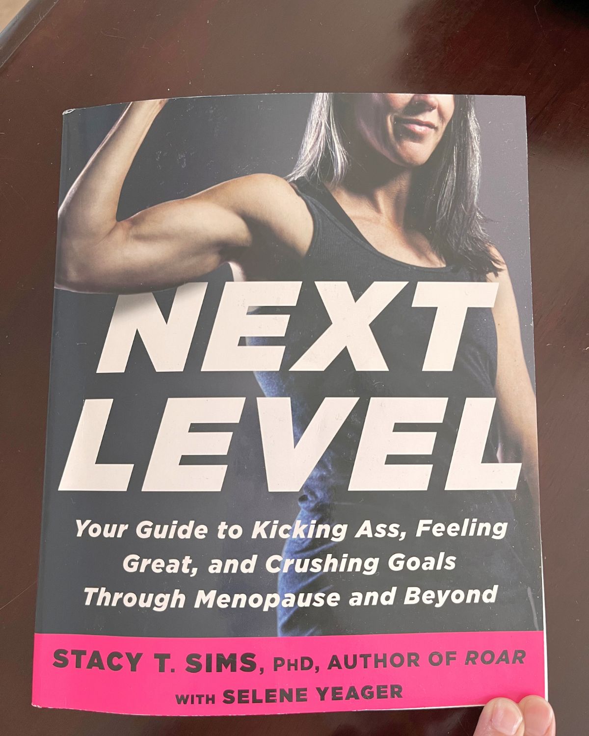 copy of next level by stacy sims on wood table.