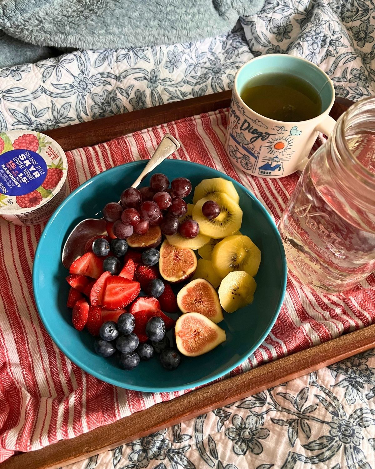 breakfast tray with a large fruit salad.