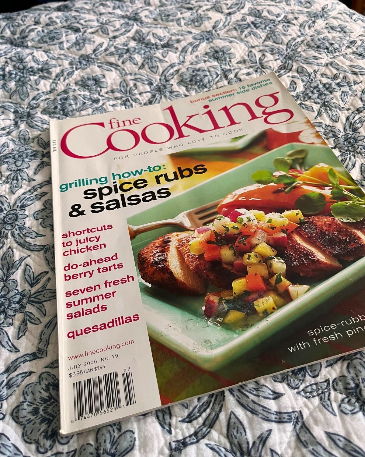 a hard copy of fine cooking magazine on a quilt.