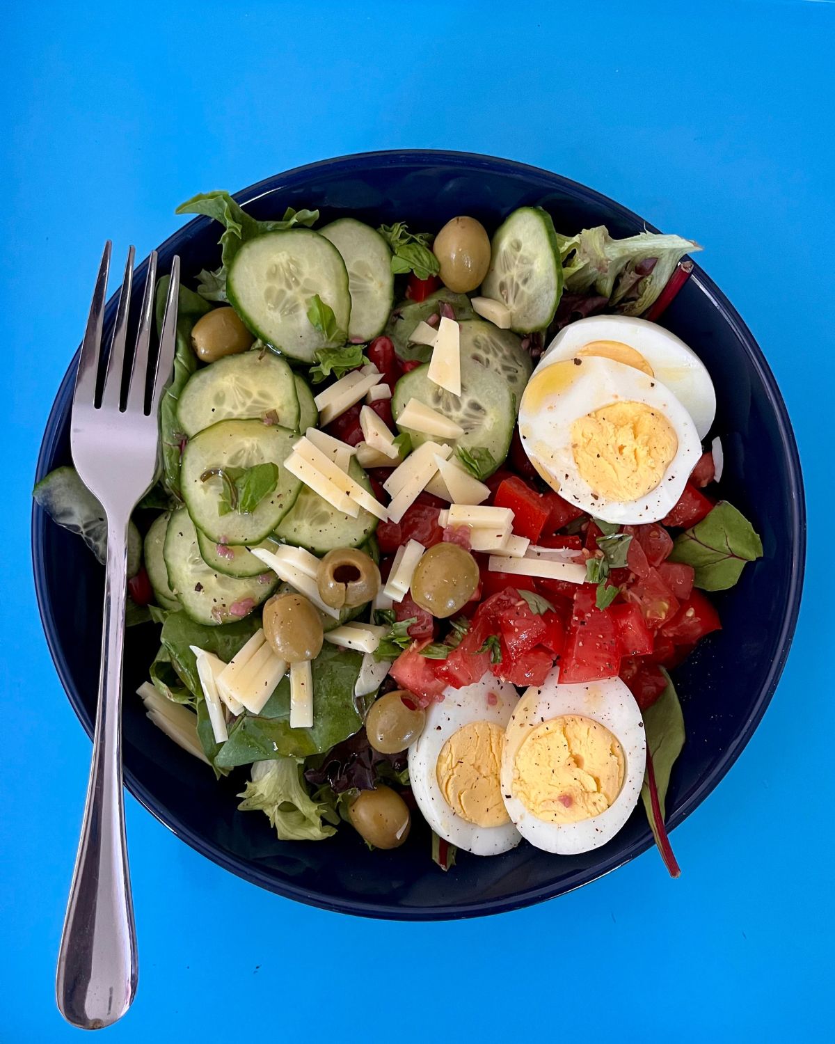 salad on vibrant blue tray.