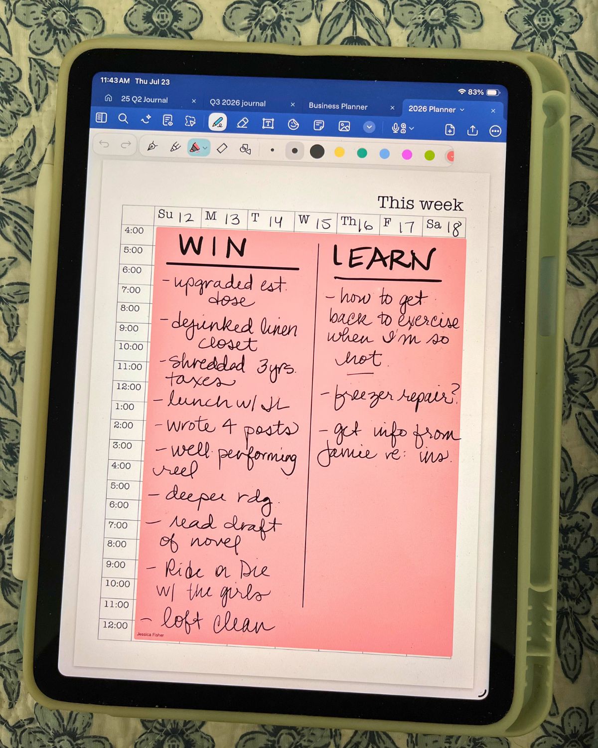 list of wins and learns on iPad on bedspread.