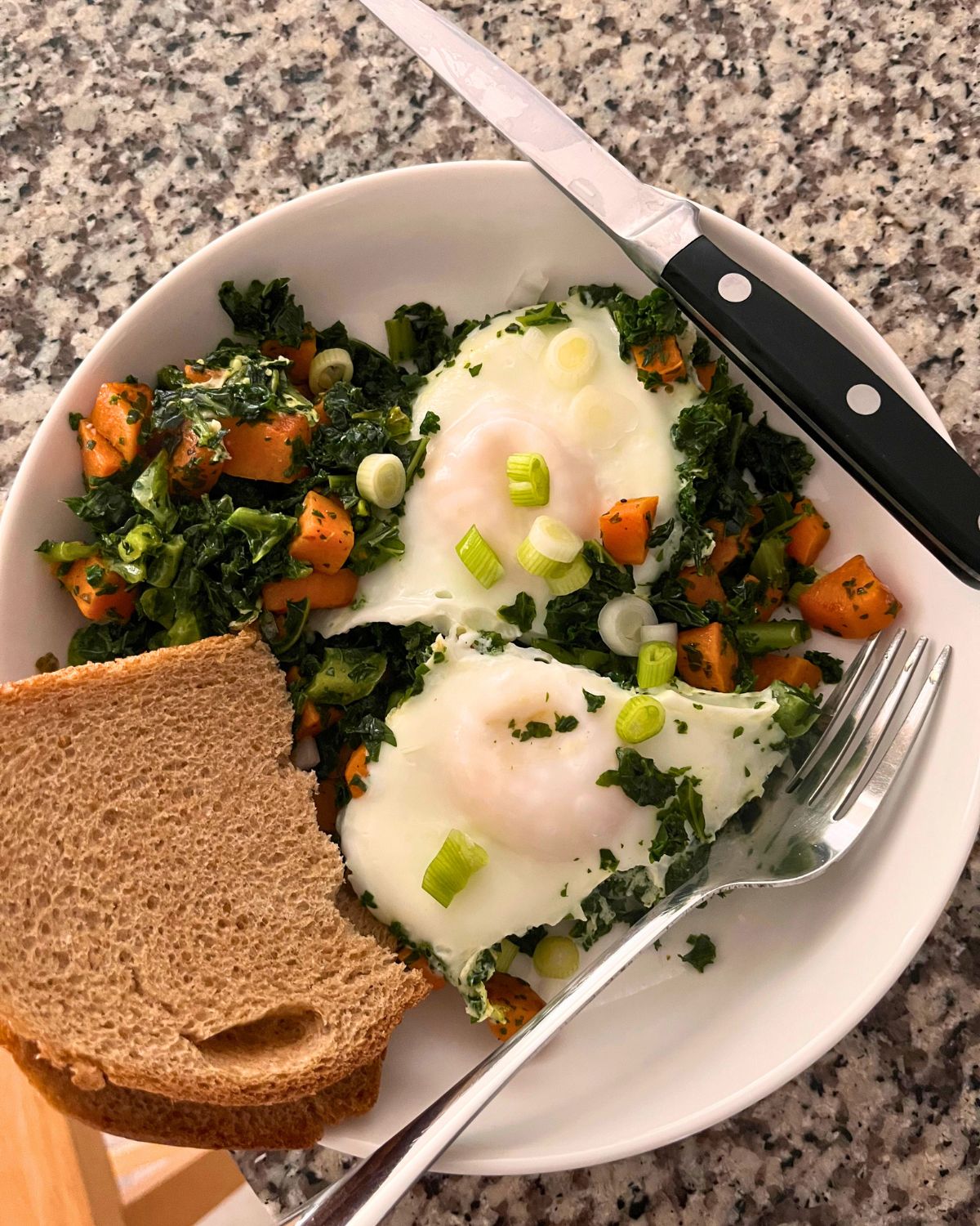 bowl of fried eggs and veg, with toast.