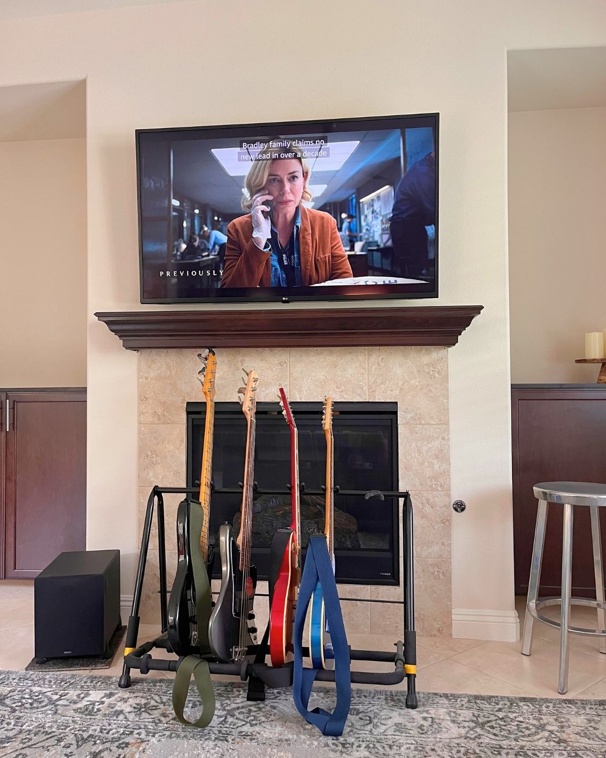 last episode of gone on tv with guitar rack under television.