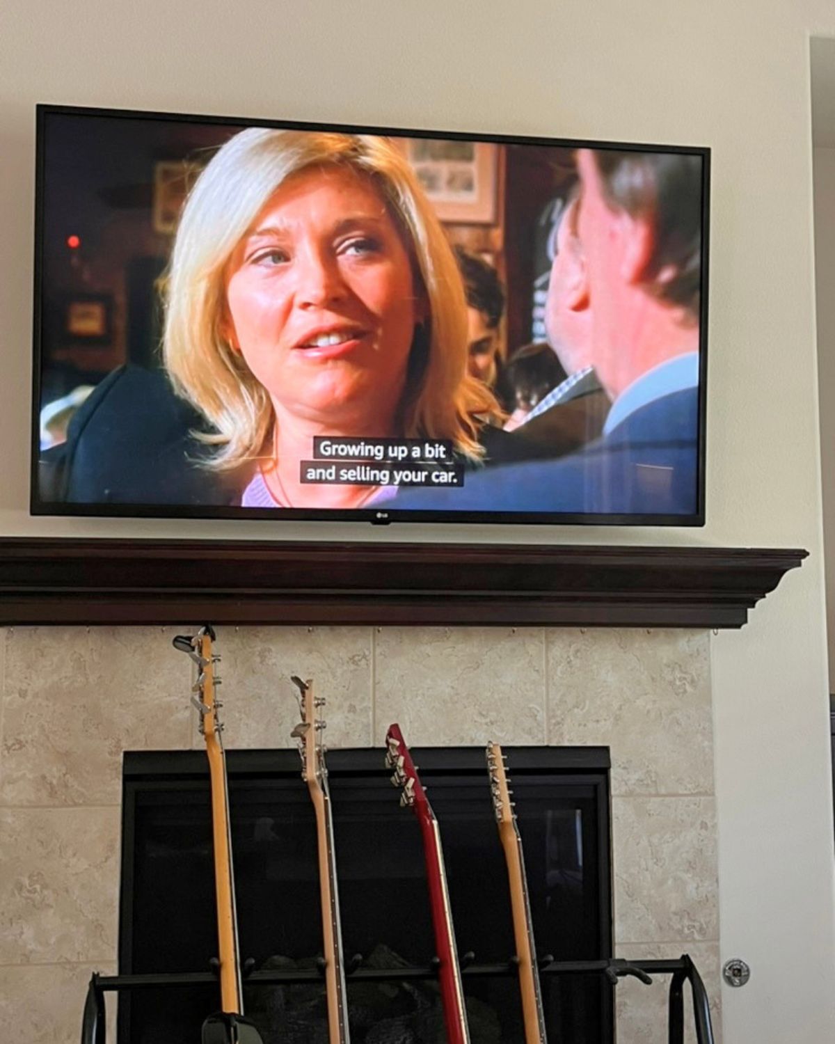 new tricks on the tv above the guitars.