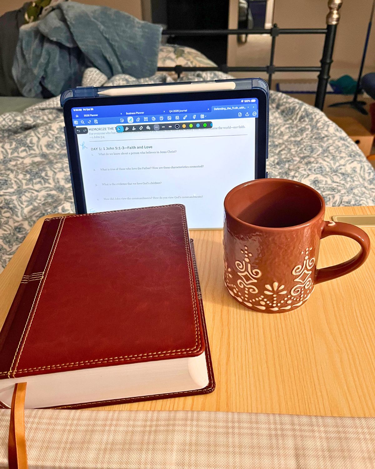 bible and mug on lap desk.