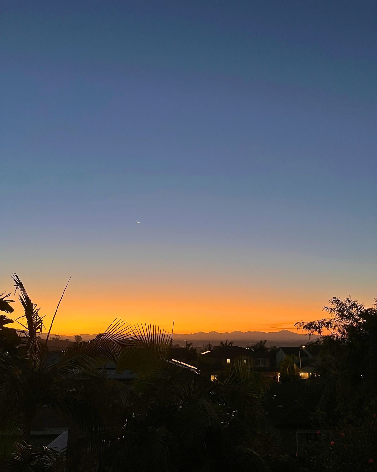moonset at the sunrise, no clouds in the sky.